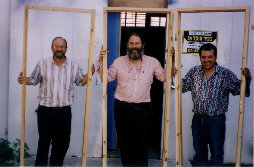 Eitan, Moshe, and Leon in front of the warehouse before the firebombing